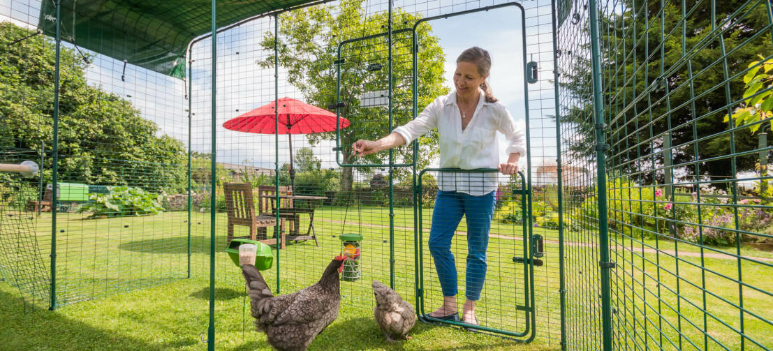 Woman opening the walk in run hi-rise stable-style door