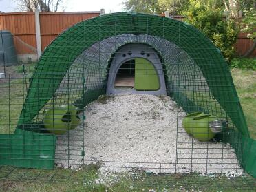 Megazorb, clear corrugated plastic run cover, a couple of bungees and green lawn edging