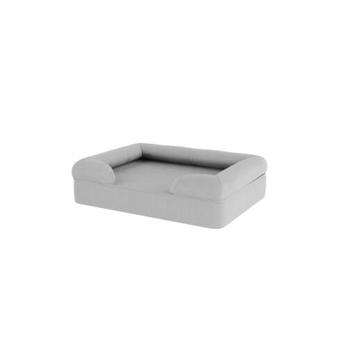 A bolster dog bed in grey.