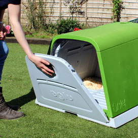The Eglu Go has a single large door at the back, which you can open to reveal the roosting bars, nesting area and dropping tray.