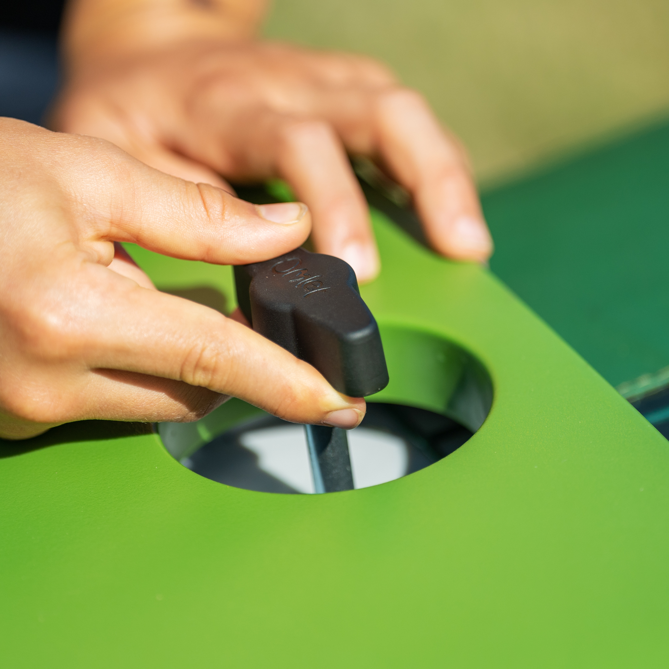 Opening the front door of an Eglu Go Hutch.